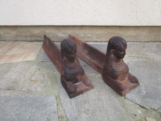 Pair of ancient cast iron chenets, Egyptian busts