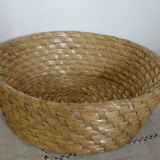 Trash has fruit in natural tied straw