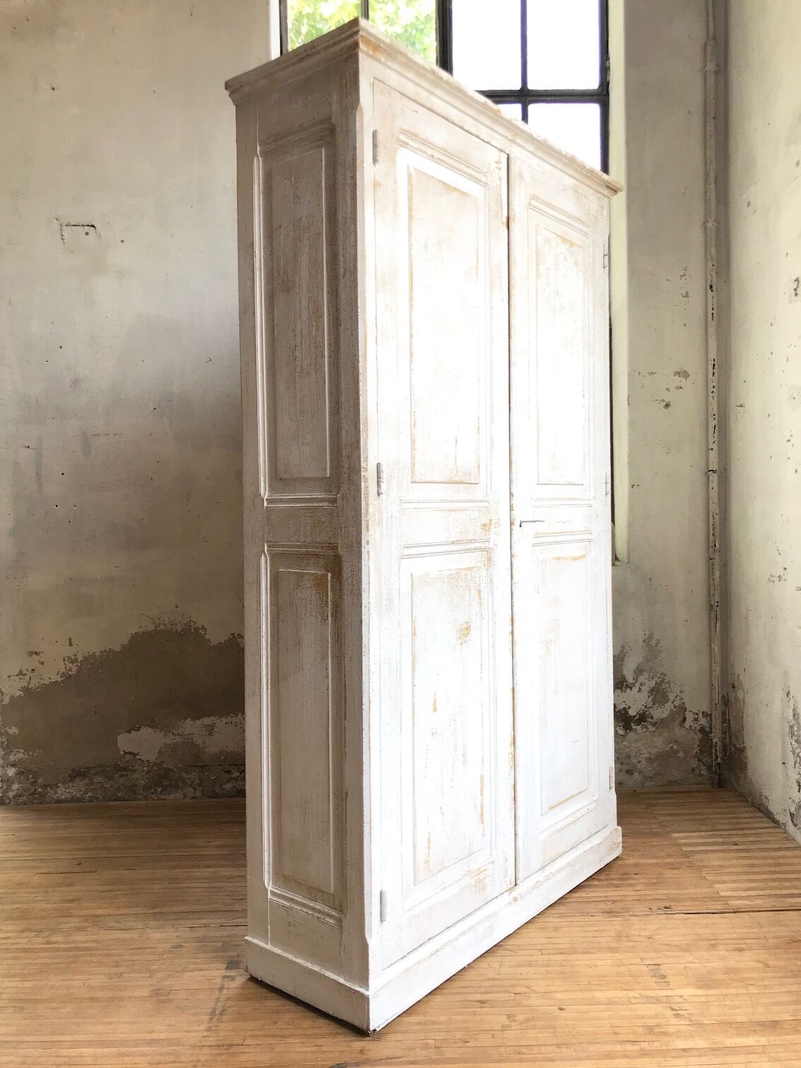 Antique wardrobe in patinated pine