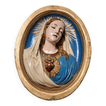 Vintage plaster frame of the Virgin, old religious painting