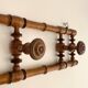 Vintage wooden wall coat rack with 4 swivel hooks from 1920