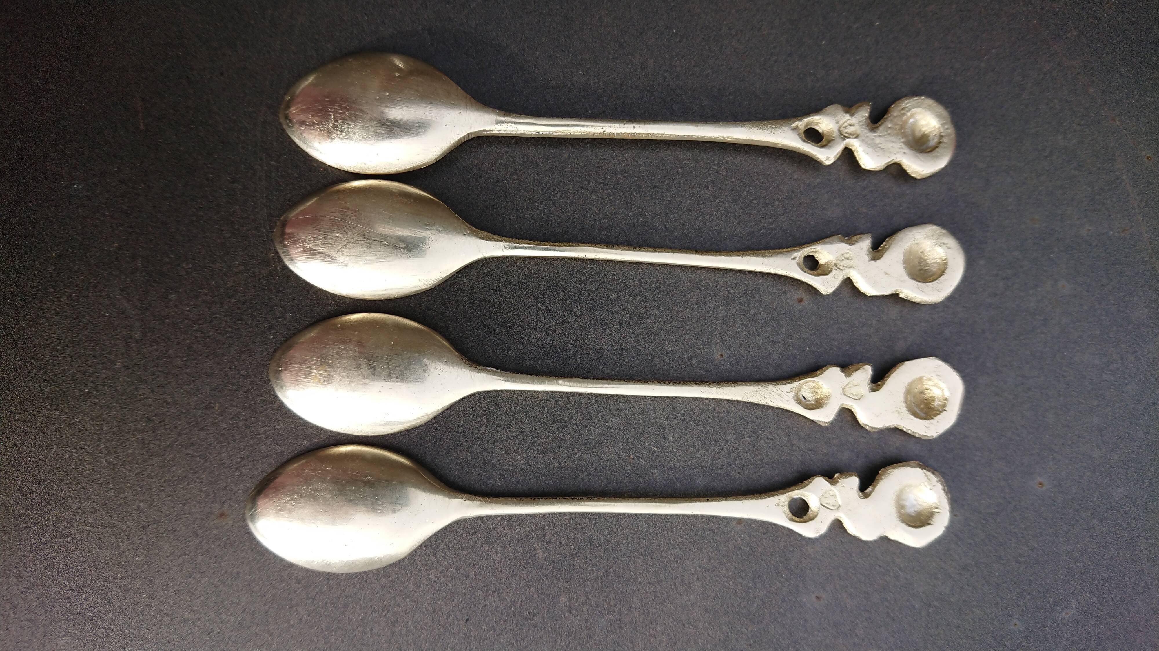 Small golden spoons with punch