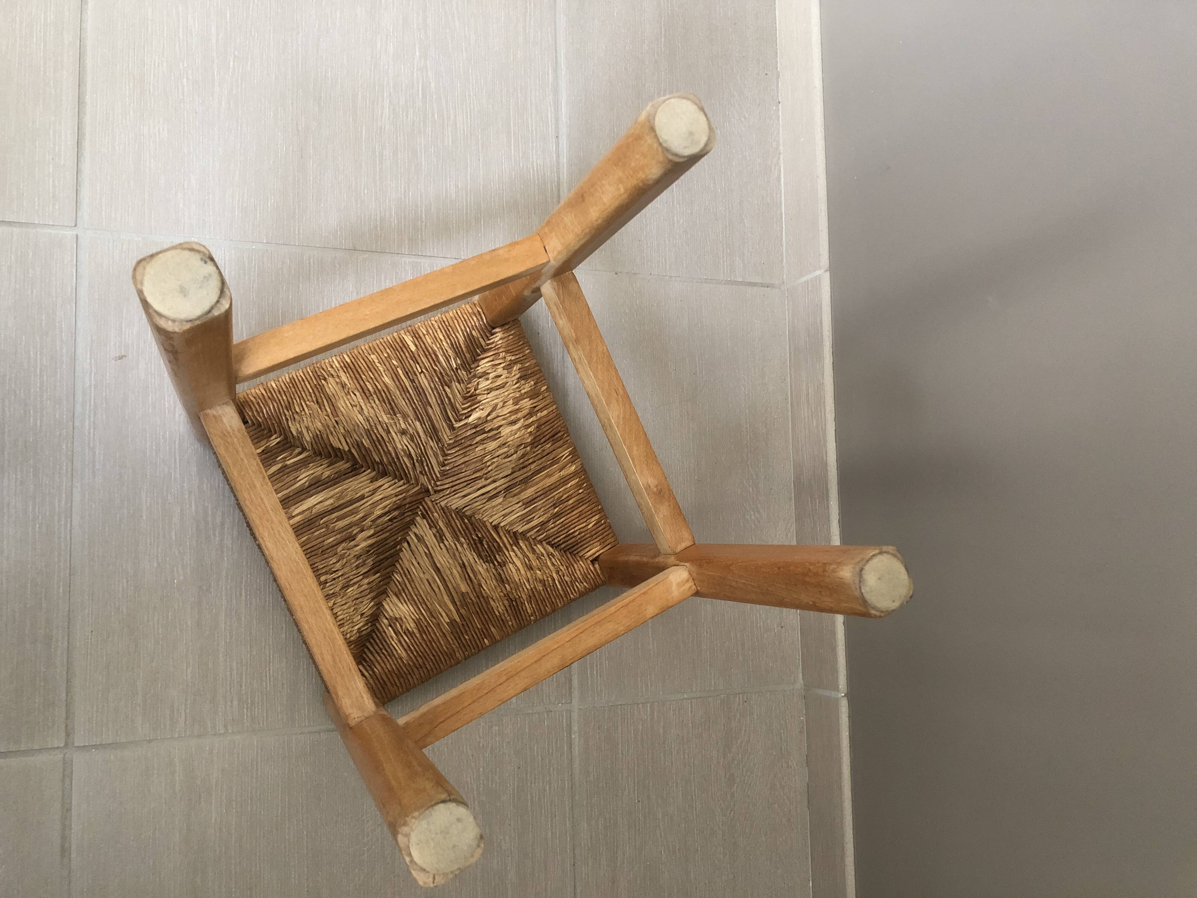 Wooden stool with straw seat