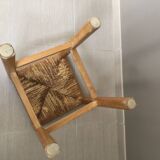 Wooden stool with straw seat