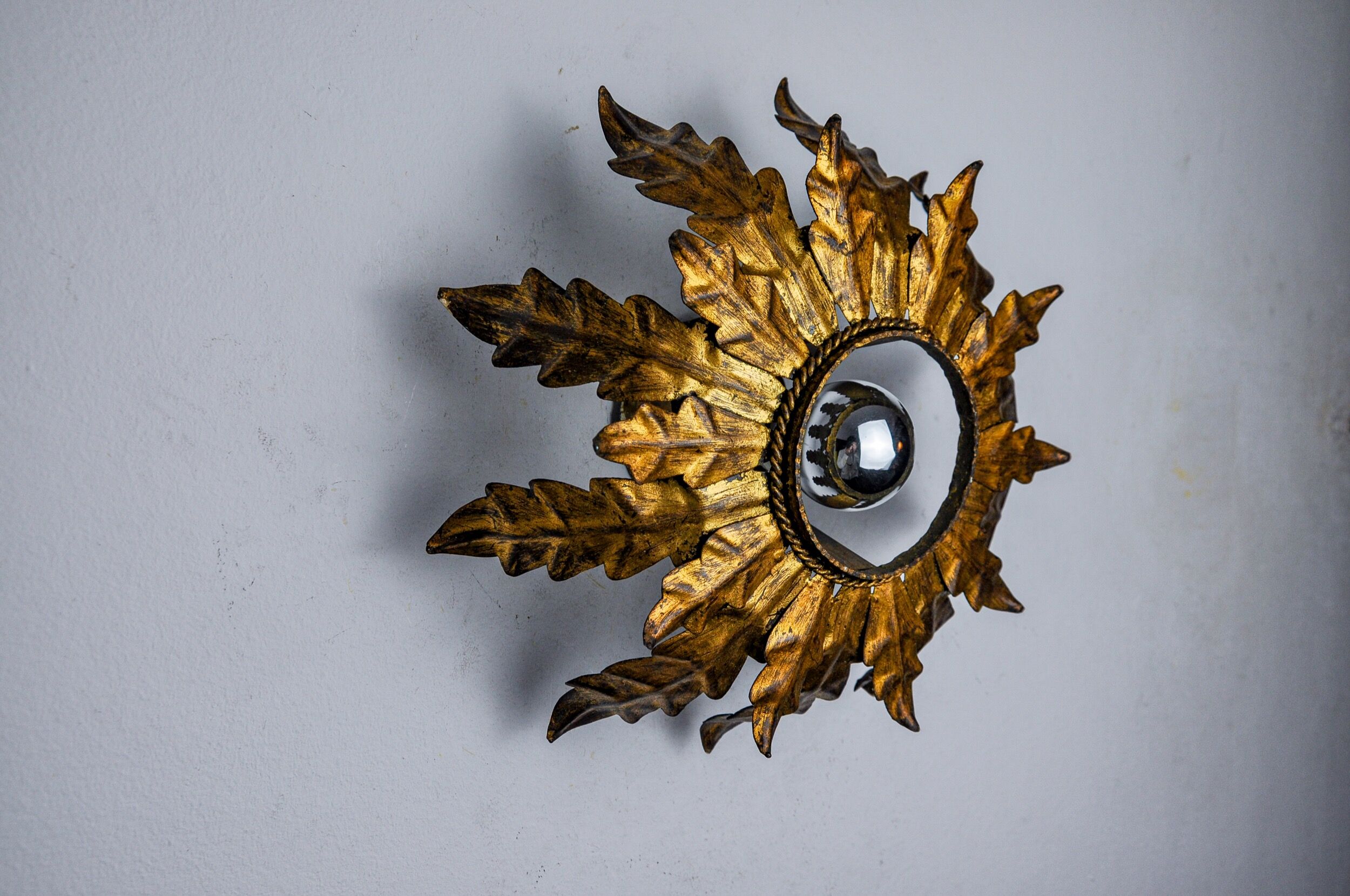 Sun wall lamp by ferro arte, metal and gold leaf, Spain, 1960