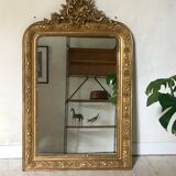 Golden fireplace mirror with pediment