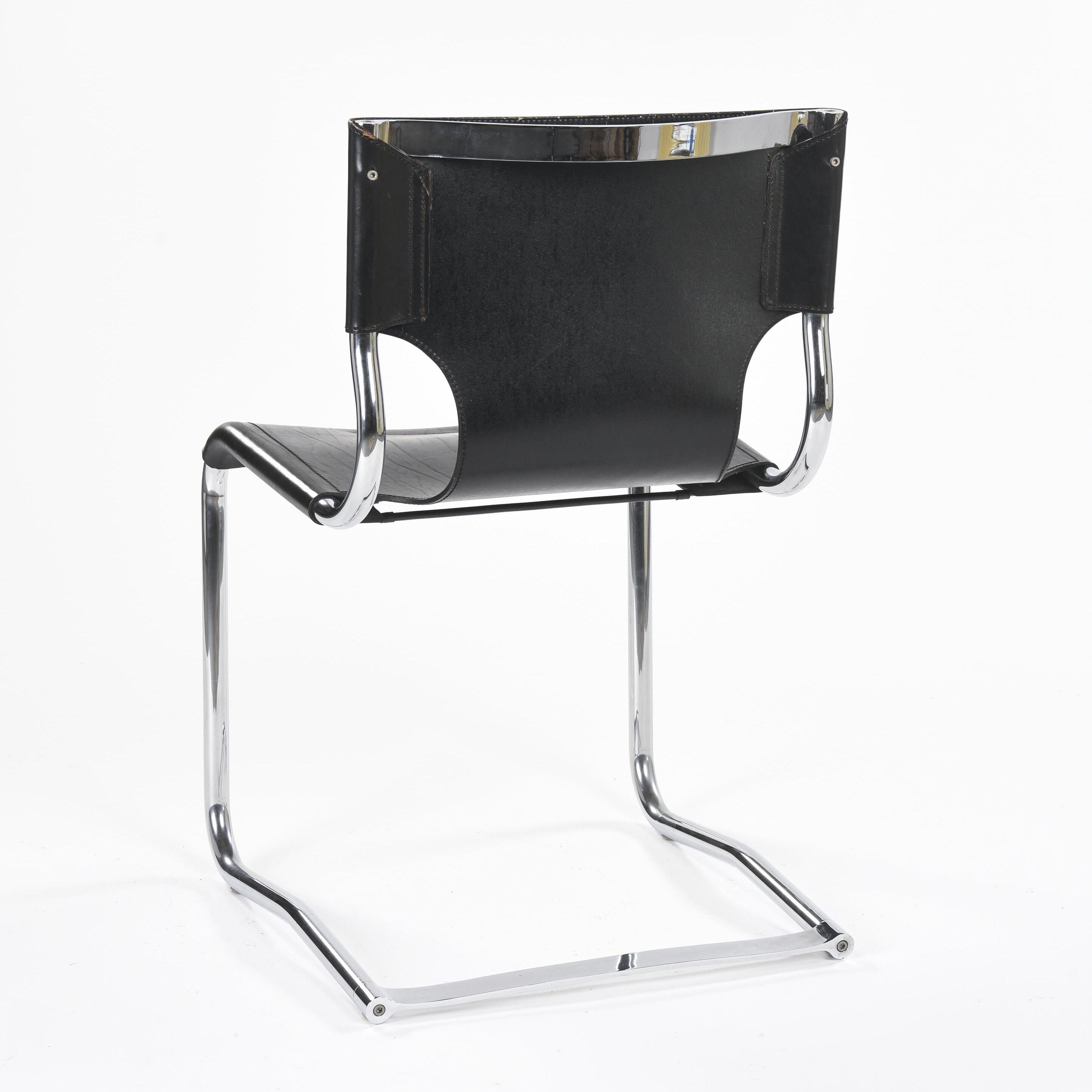 Black leather chairs by Carlo Bartoli