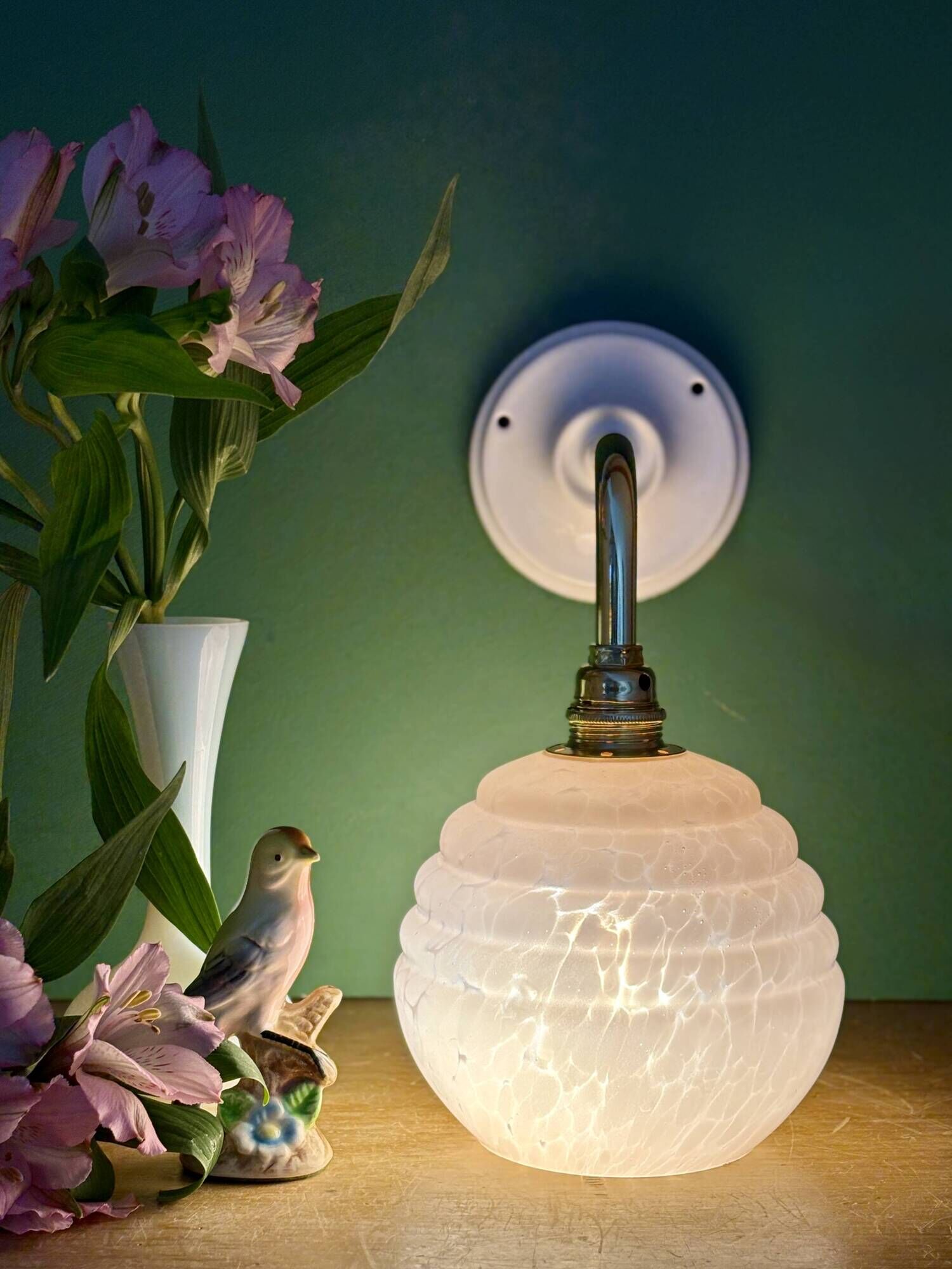 Vintage pink Clichy glass globe wall light.