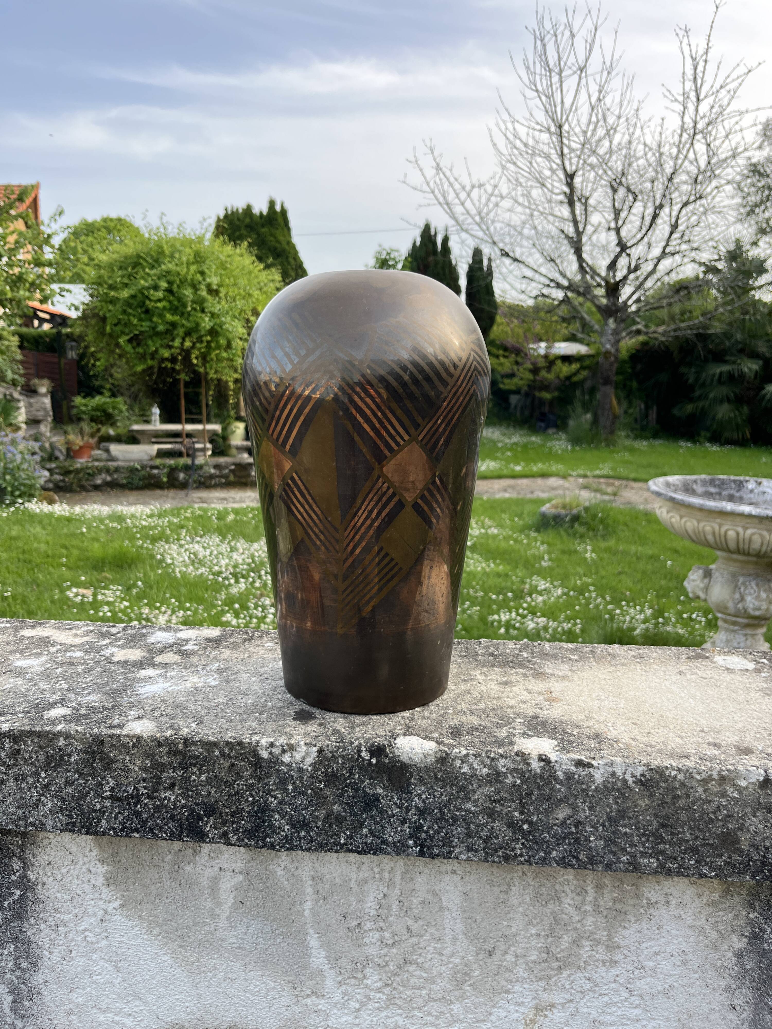 Art Deco vase in brass with geometric patterns