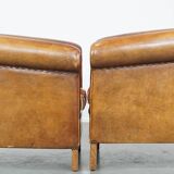 Set of 2 cognac-colored sheepskin club chairs with colorful fabric cushions