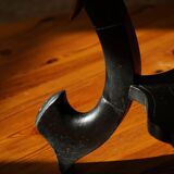 Side table in hardwood ebony with three elephant head-shaped legs, Eastern India, 1920s.