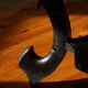 Side table in hardwood ebony with three elephant head-shaped legs, Eastern India, 1920s.