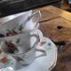 6 porcelain cups decorated with wildflowers from the 60s.