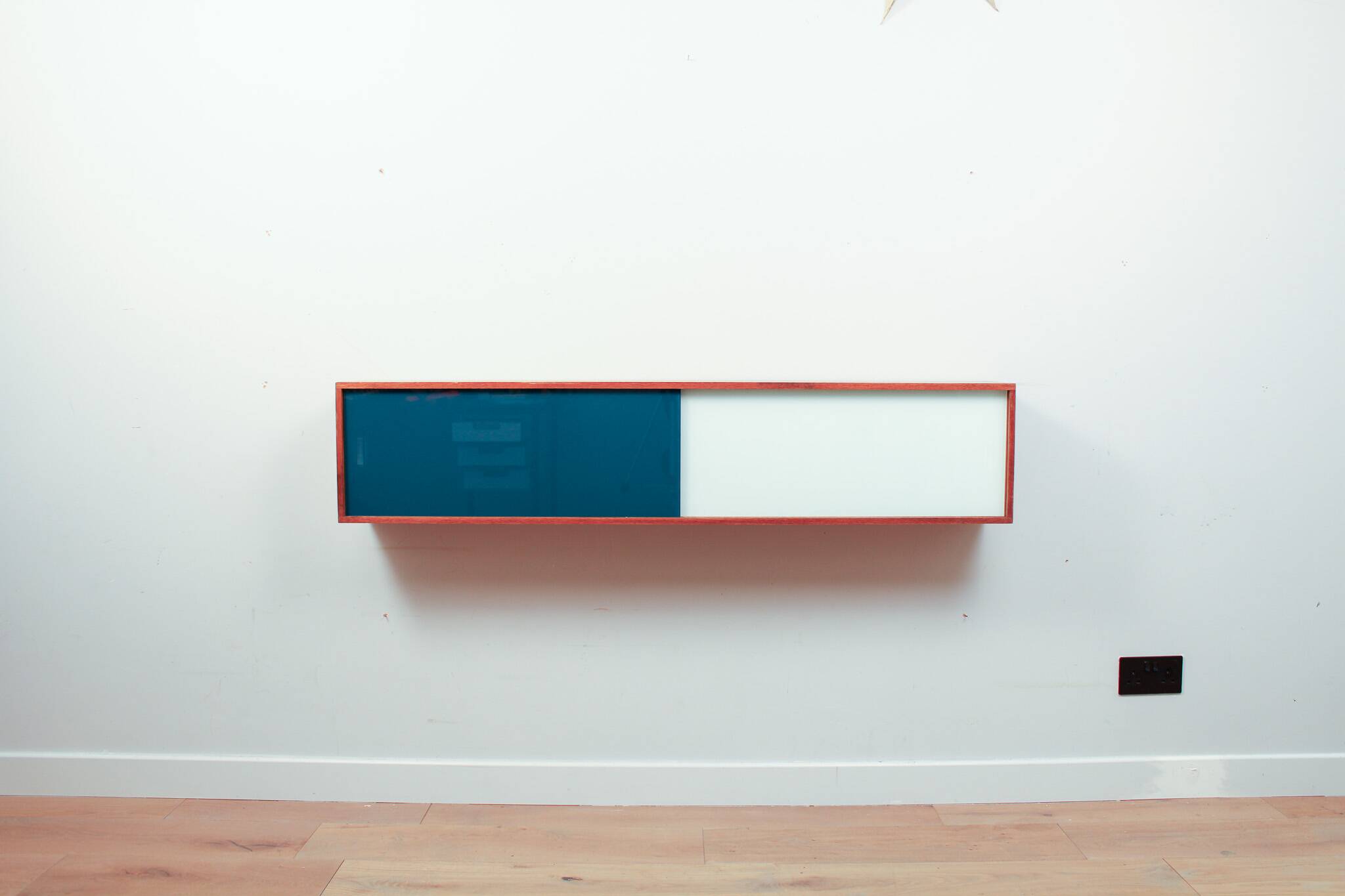 Vintage mid-century wall hung oak cabinets, blue & white sliding glass door