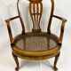 Fauteuil bas anglais en bois ajouré à assise cannée, 19e siècle
