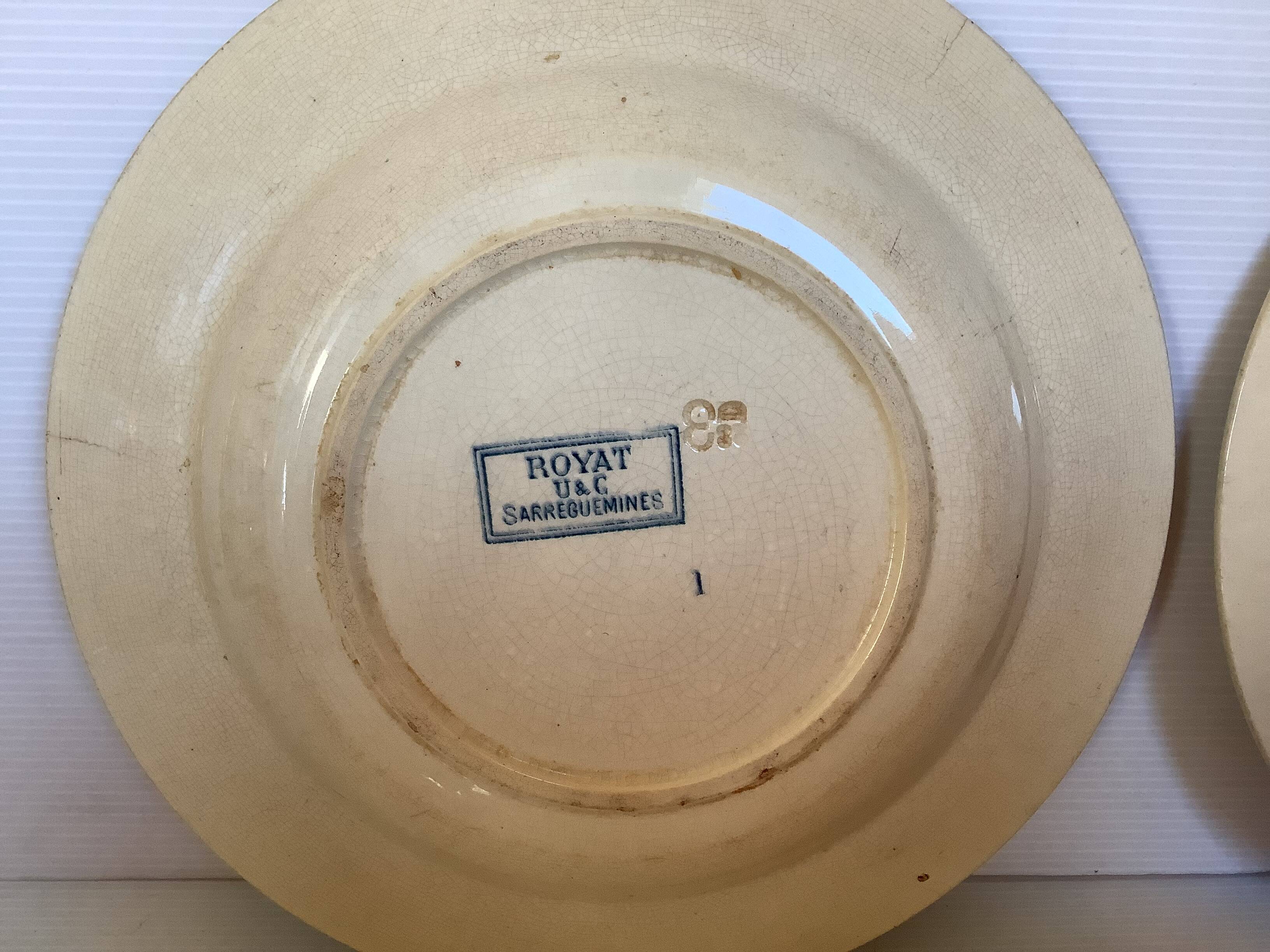 Four old earthenware plates