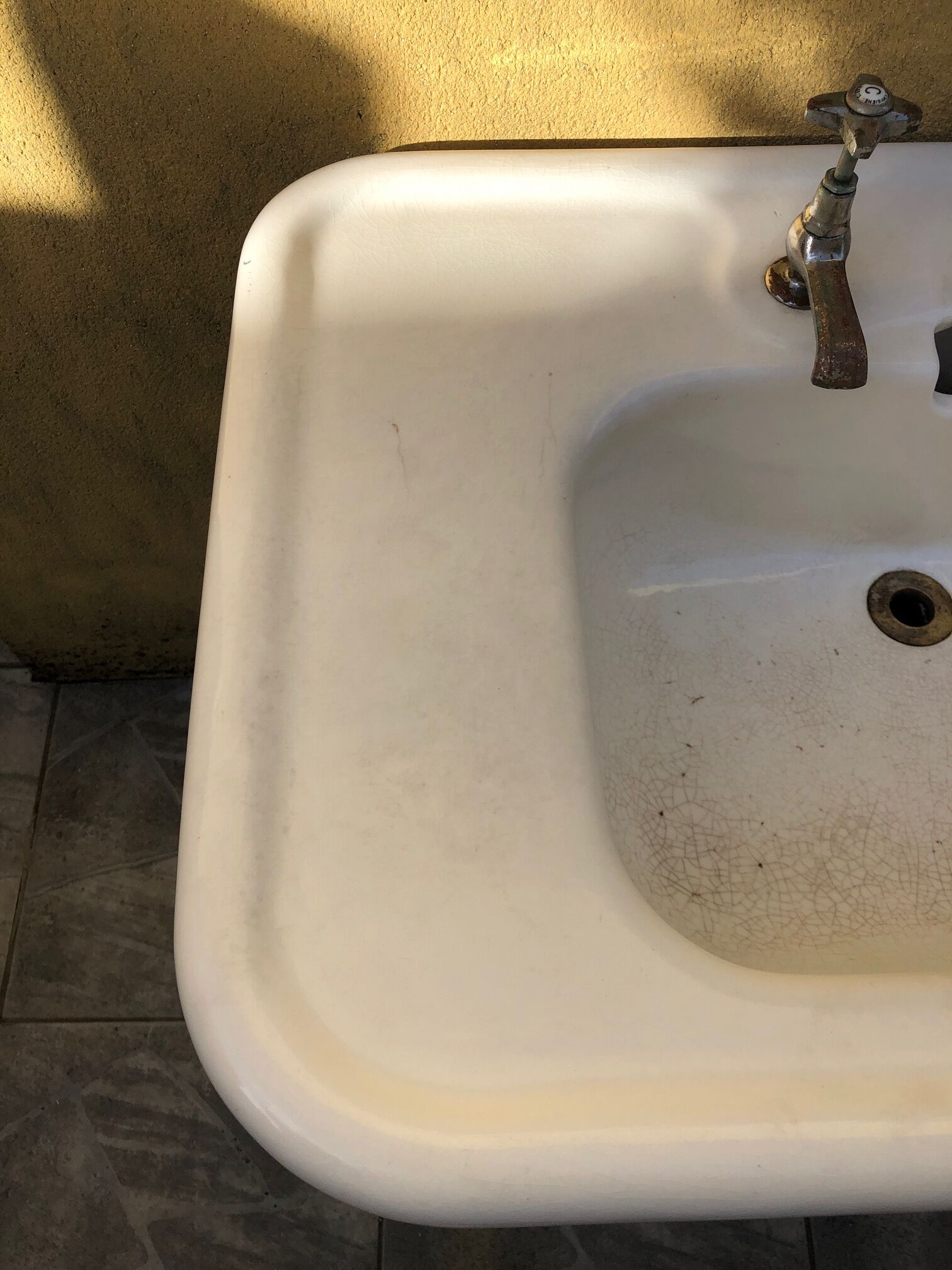 Antique washbasin on ceramic column