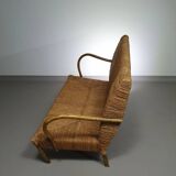 Vintage French papercord sofa with a metal frame base