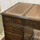 English mahogany pedestal desk with leather top from the 1950s