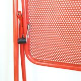 Perforated metal folding chair