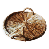 Medium round dark wicker plateau with two handles.