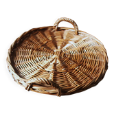Medium round dark wicker plateau with two handles.