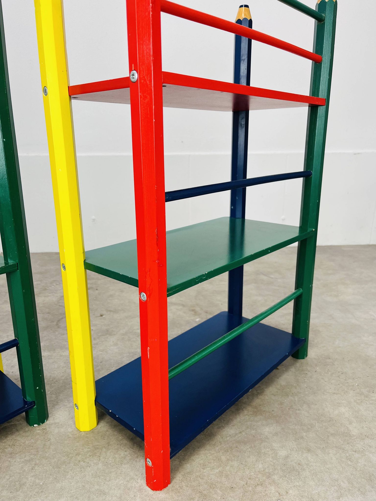 Pair of pencil-style shelves by Pierre Sala for children.