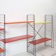 Tomado shelf in coloured metal floor shelves from 1958.