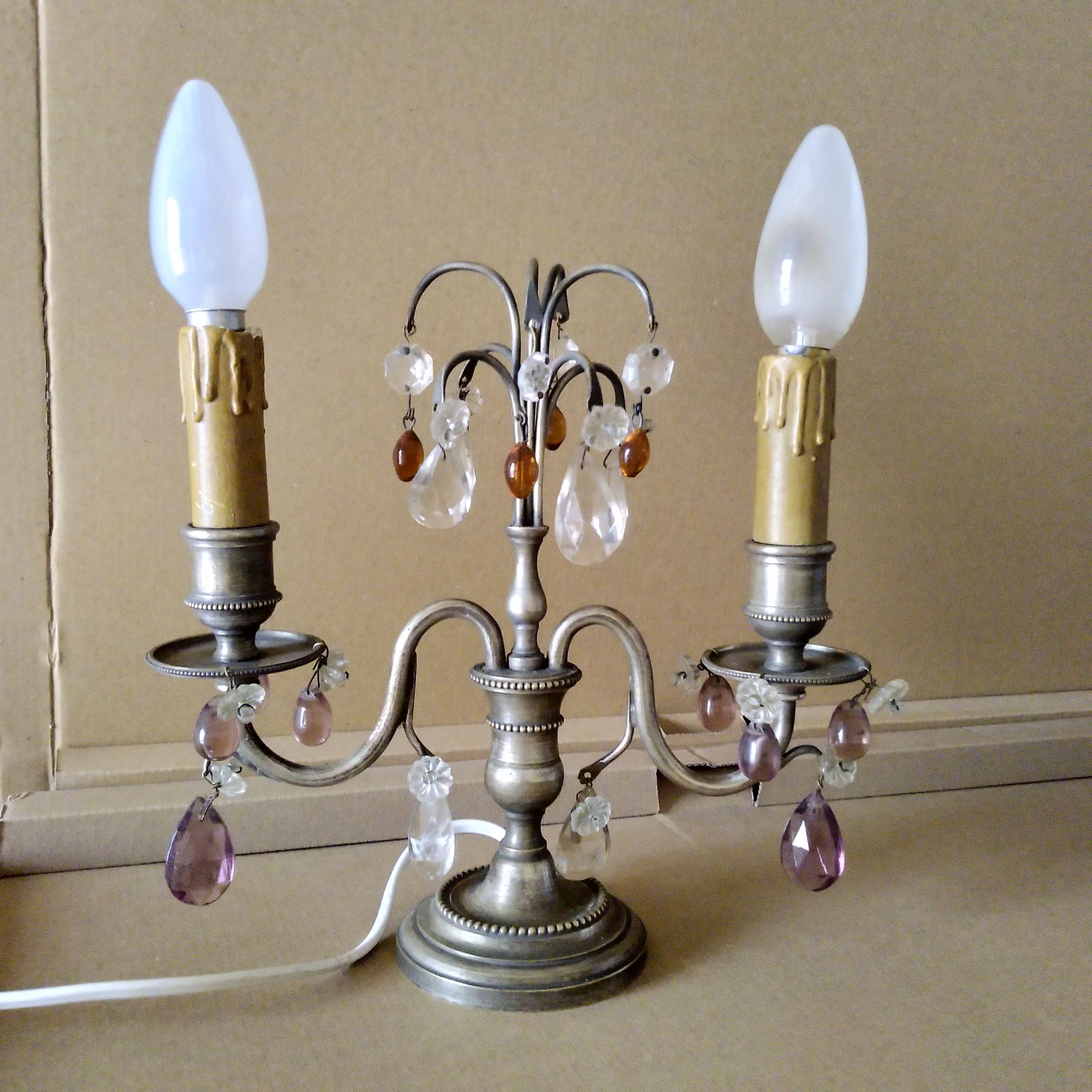 Pair of girandole lamps and silver metal