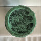 Vintage green patinated ceramic vase with raised floral decoration.