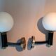 Pair of wall lights in gilded and black lacquered brass, Italy 1970/1980.