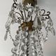 Grand chandelier in Louis XV style with crystal pendants.