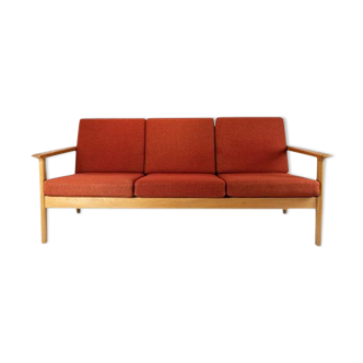 Three seater sofa of oak and red wool fabric designed by Hans J. Wegner