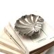 Art Deco ashtray in the shape of a shell in silver-plated metal.