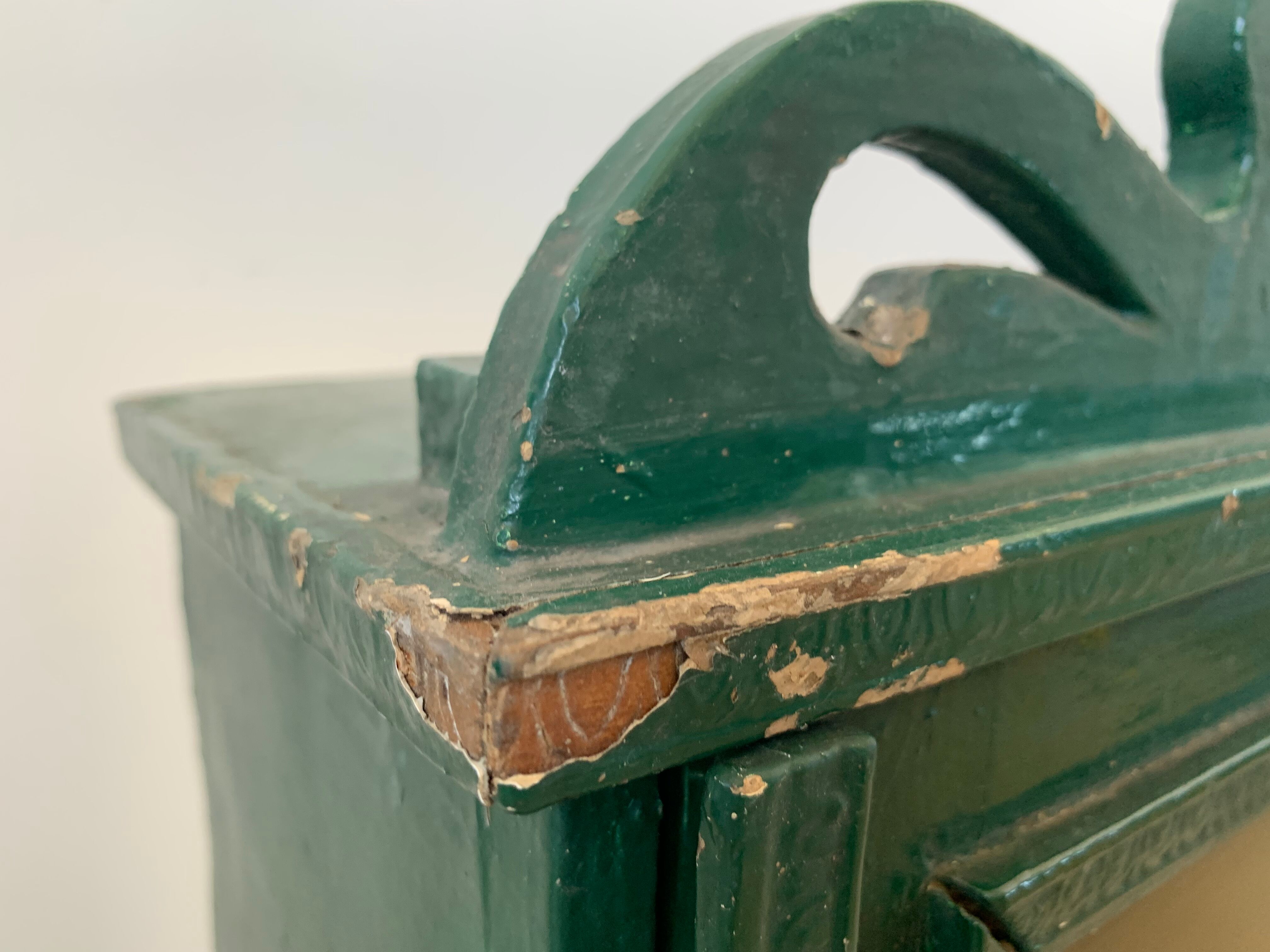 Wall vitrin with pediment