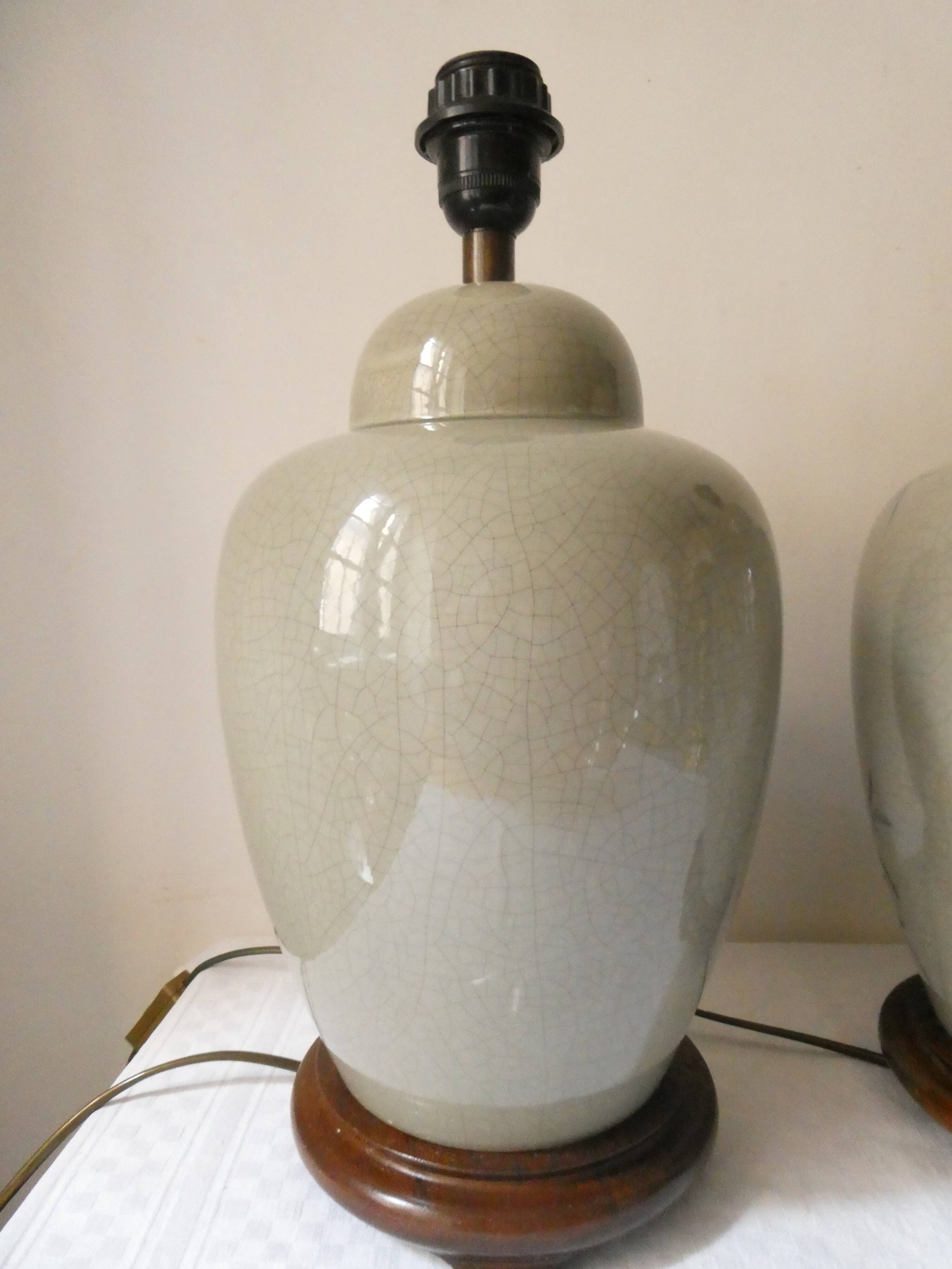 Pair of celadon crackle ceramic lamp bases decorated with flowers.