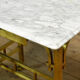 Small brass table with marble top, circa 1910