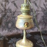 Repoussé brass lamp with floral motifs, decorated with 3 miniature medallions