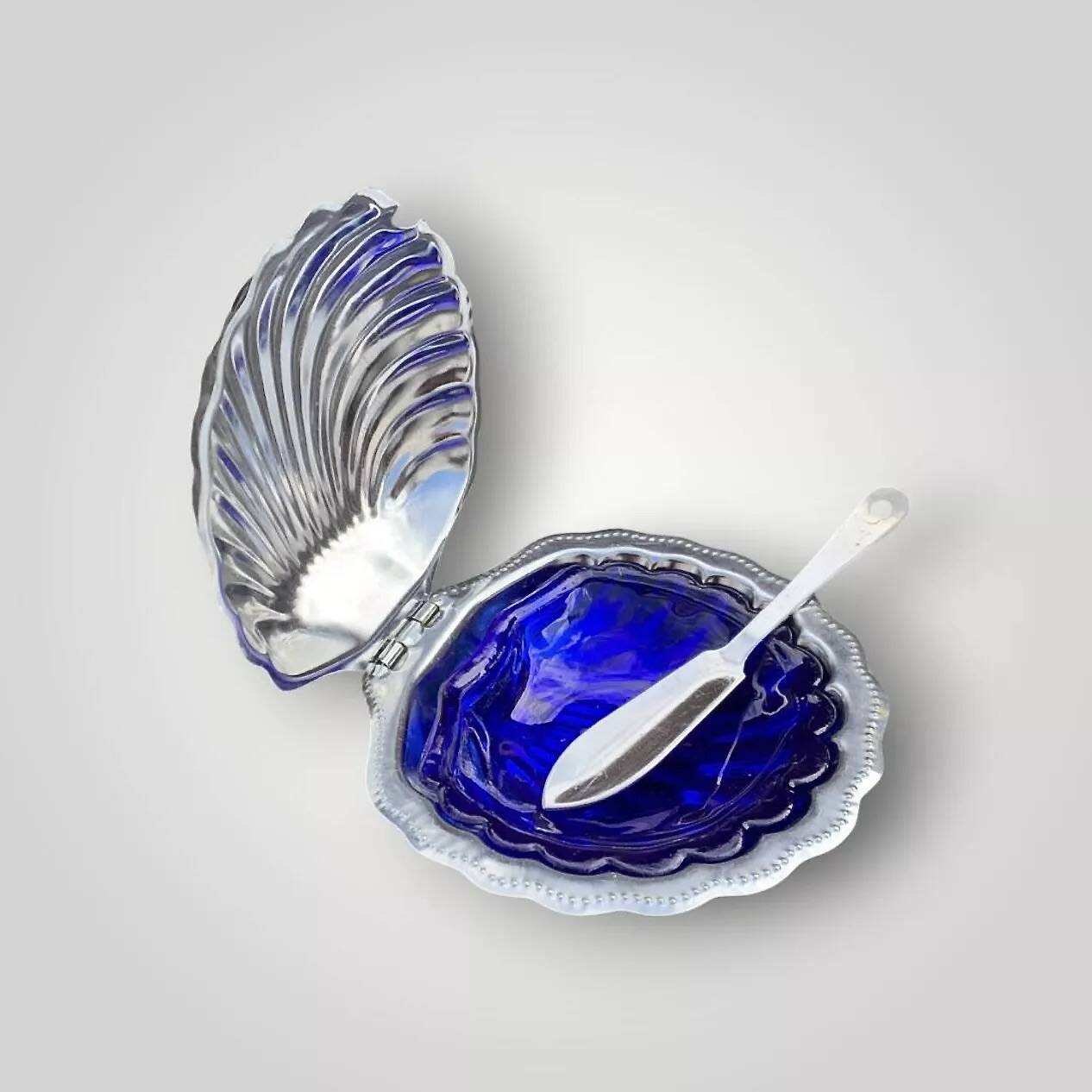 Vintage shell butter dish in stainless steel and cobalt blue glass with knife