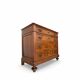 Antique walnut commode with bronze handles in the shape of a lion's mask,