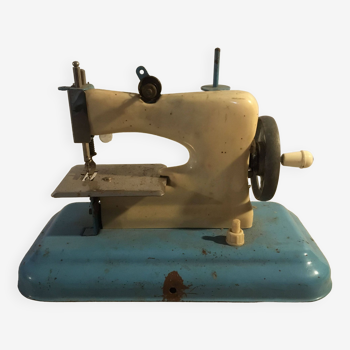 Vintage metal and plastic sewing machine toy for collection