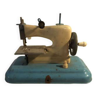 Vintage metal and plastic sewing machine toy for collection