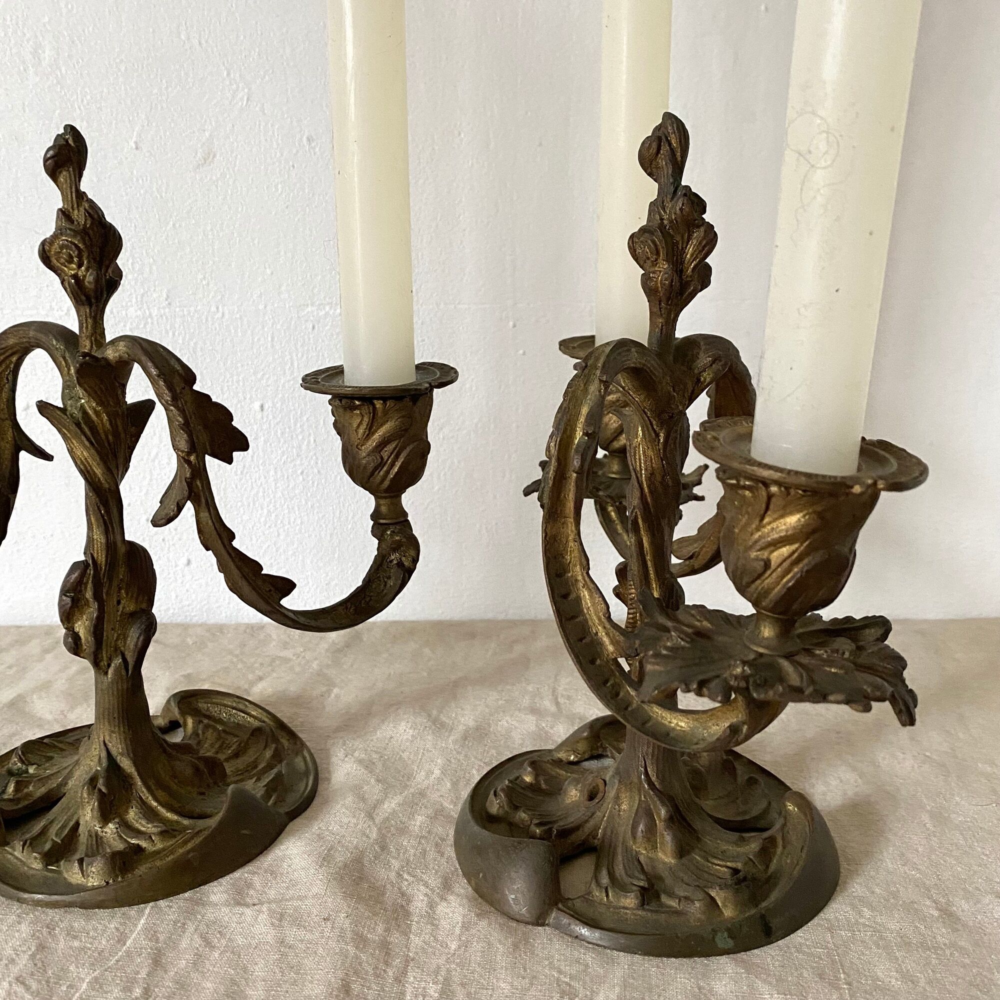 Pair of antique bronze candlesticks at the end of the table XIXth