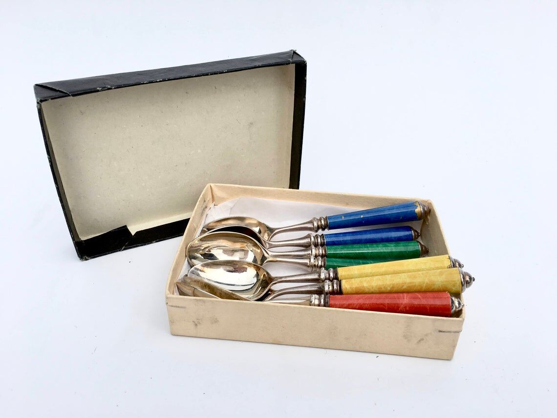 Set of eight enamelled silver spoons