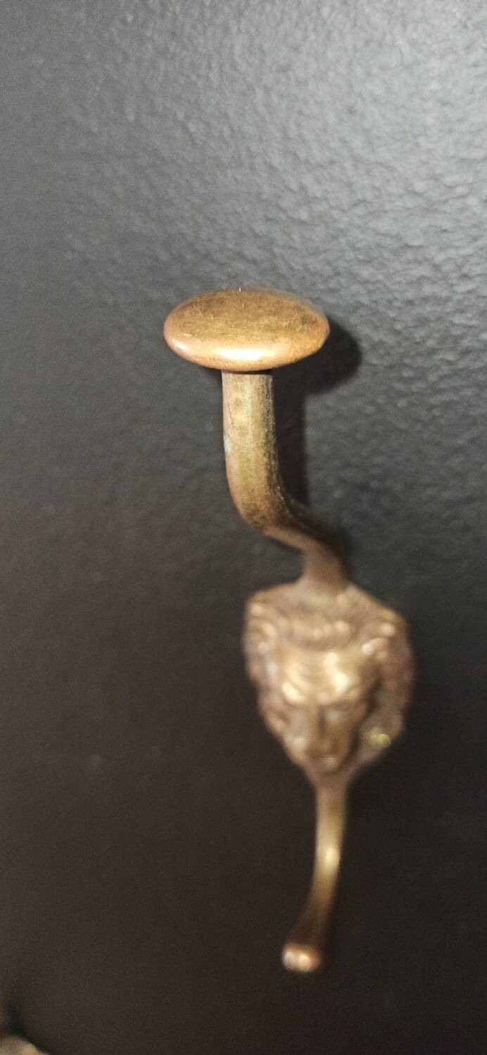 Set of 5 antique "Lion Head" coat hooks.