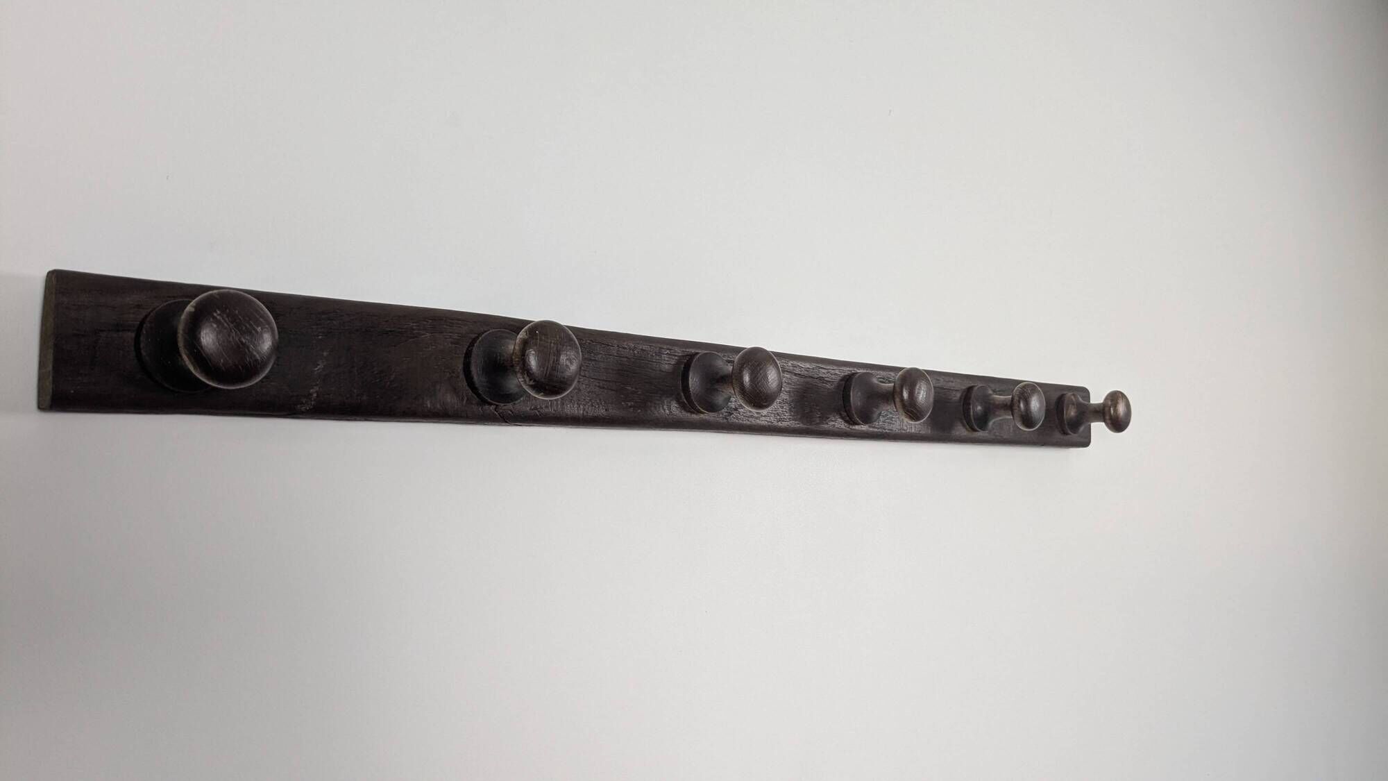 Antique turned wooden coat rack with 6 hooks, rustic spirit.