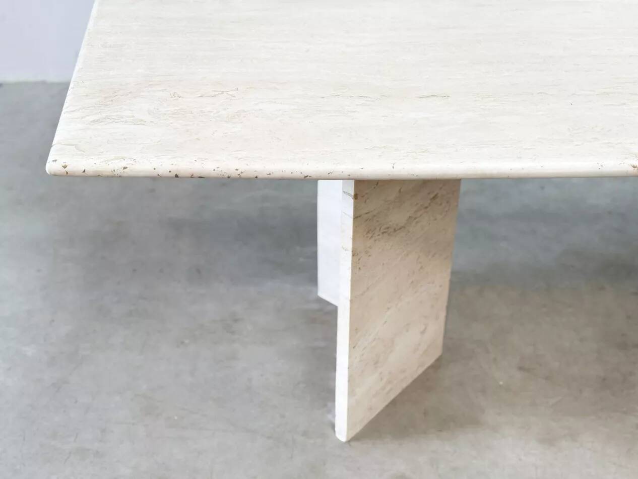 Sculptural travertine dining table