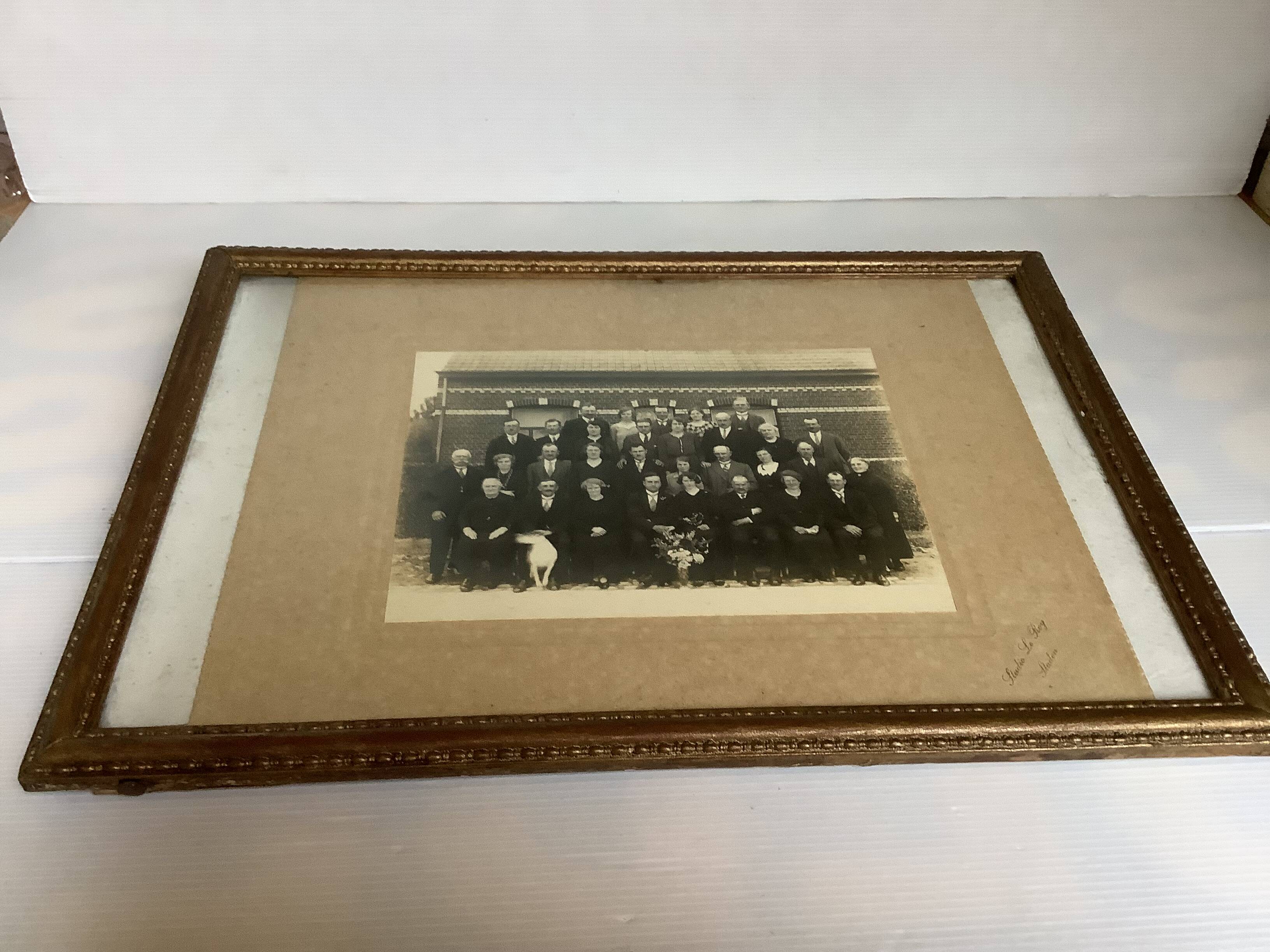 Old photograph of a newlywed couple with a dog