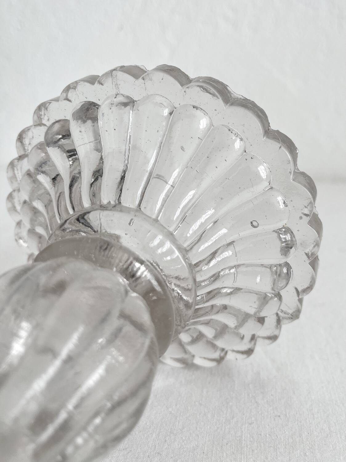 Antique baluster-shaped molded glass candlestick holder