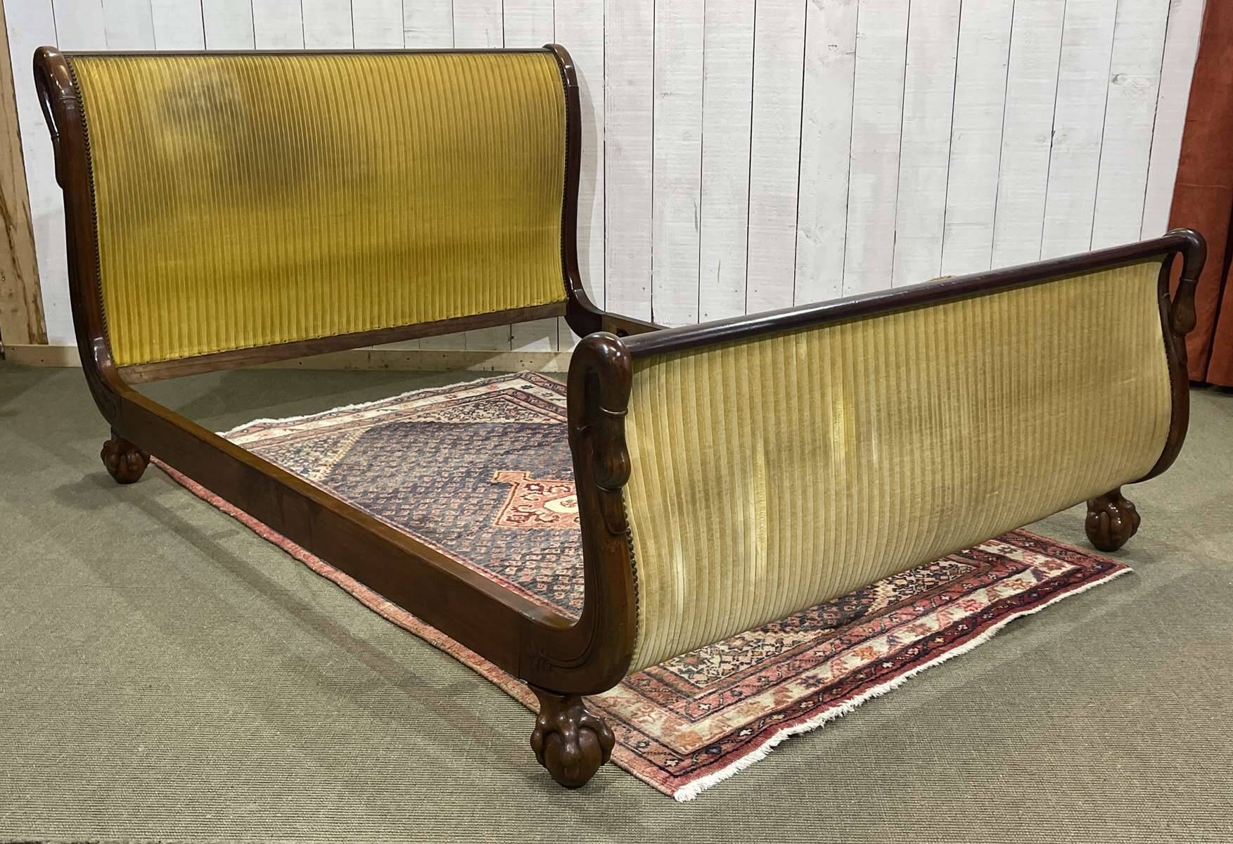 Early 19th century Empire mahogany bed with swan neck finials and claw feet
